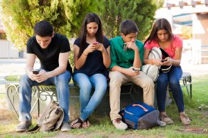 Student distracted by phone while studying due to digital addiction