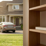 Image showing a car parked near a house and a book kept on a shelf for Class 3 preposition worksheet
