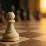 Pawn chess piece standing on a wooden chess board